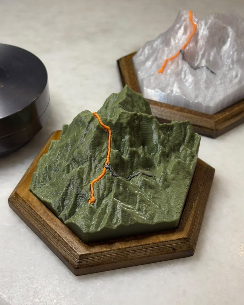 Mount K relief print in forest green on a dark wood base